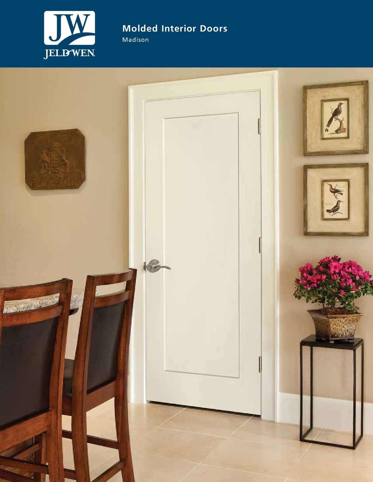 White interior door with silver handle, framed by off-white walls. Decorative art and table.