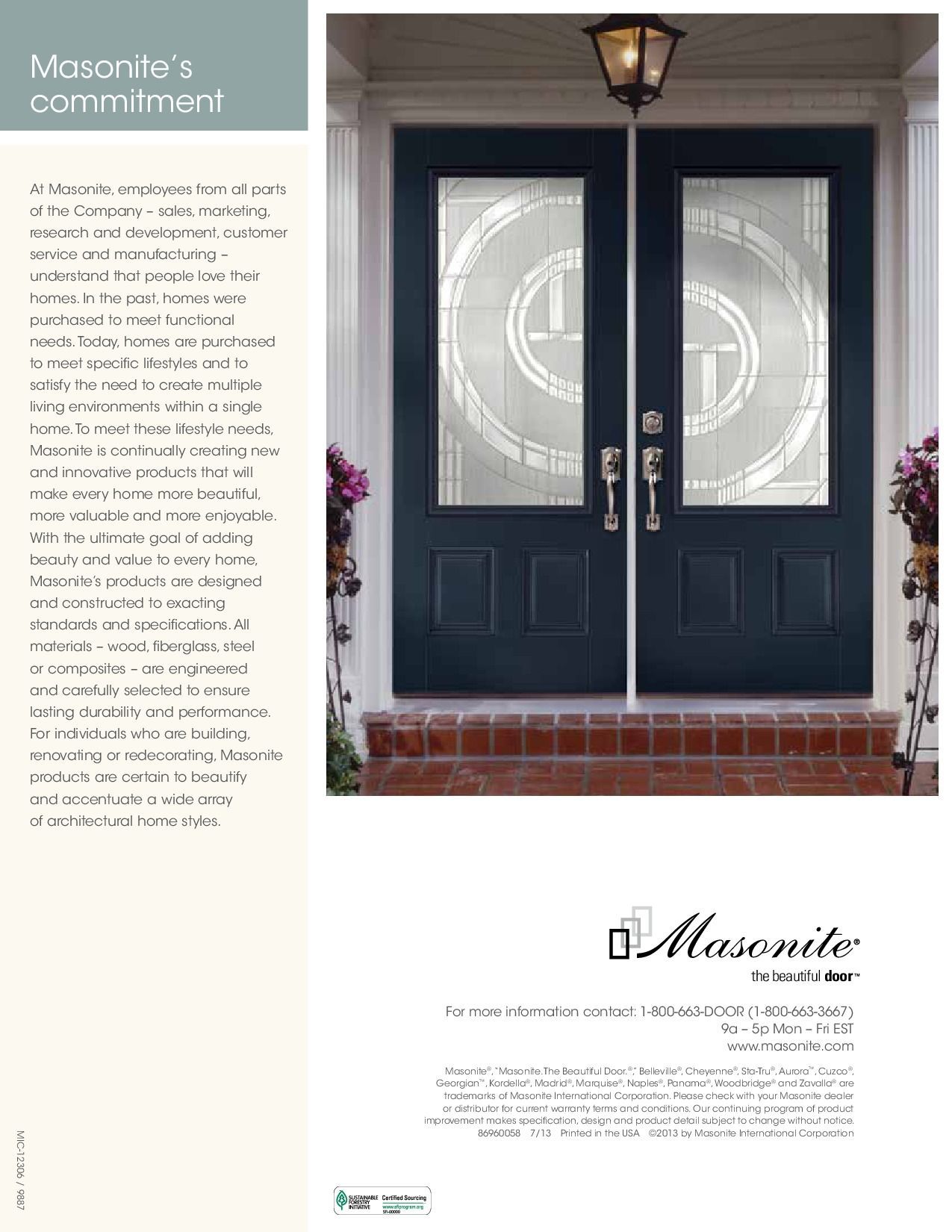 Double dark blue Masonite front doors with glass, a brick step, and porch lights.