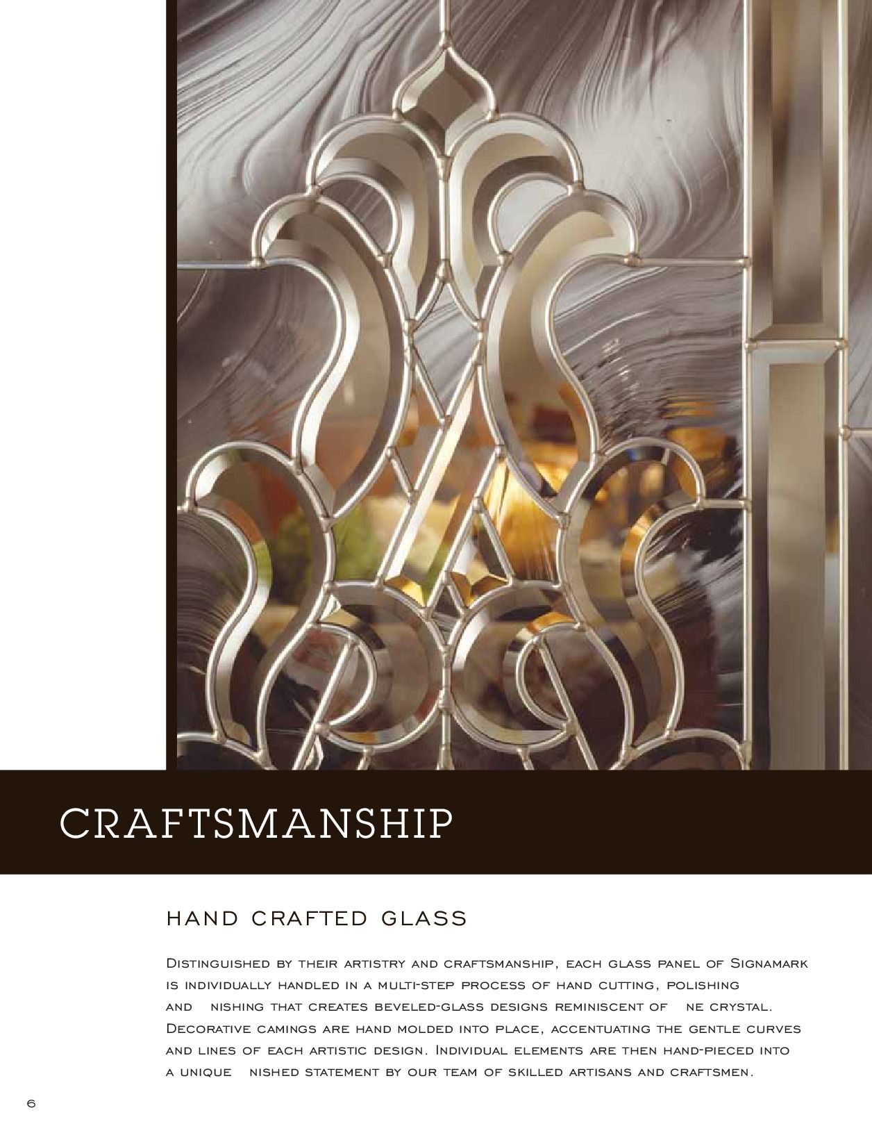 Close-up of ornate, hand-crafted stained glass design with metallic accents.