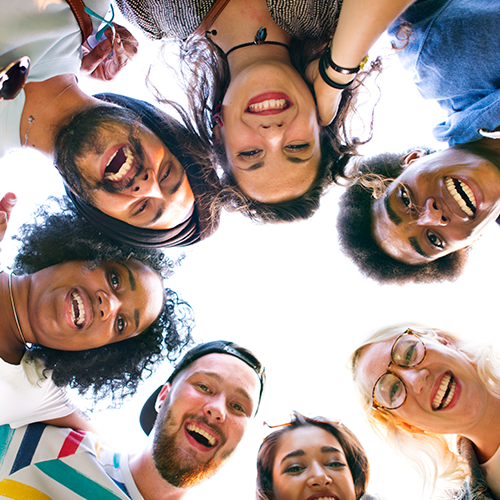 Group of people standing in a circle