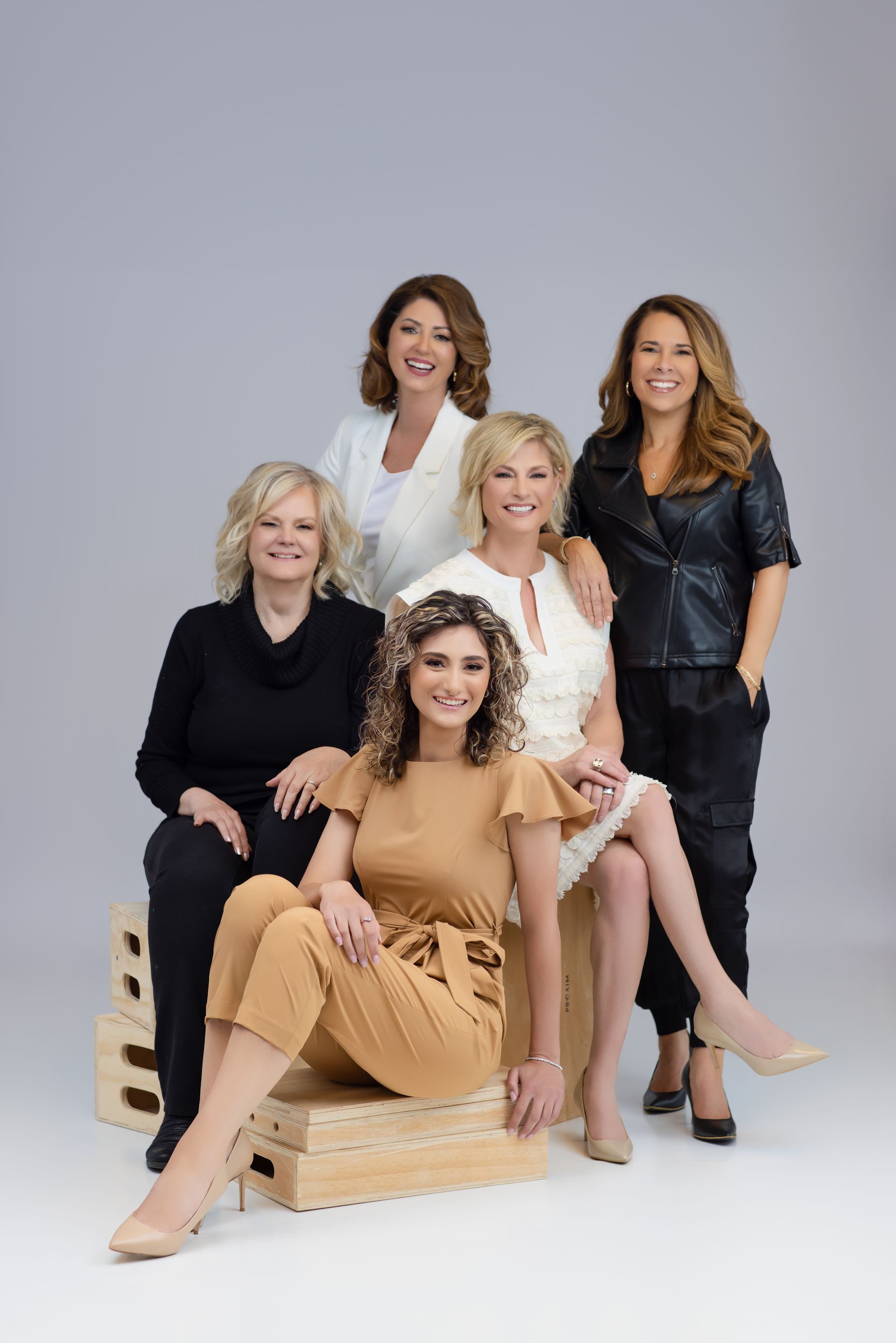 A group of women are posing for a picture together.