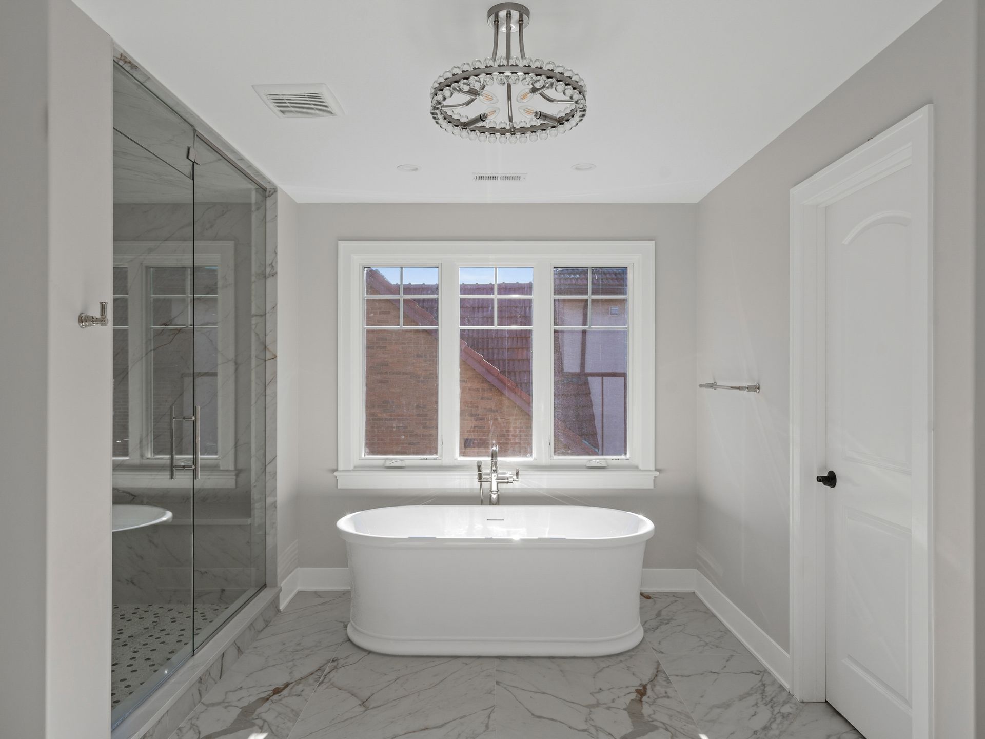 There is a bathtub in the middle of the bathroom.