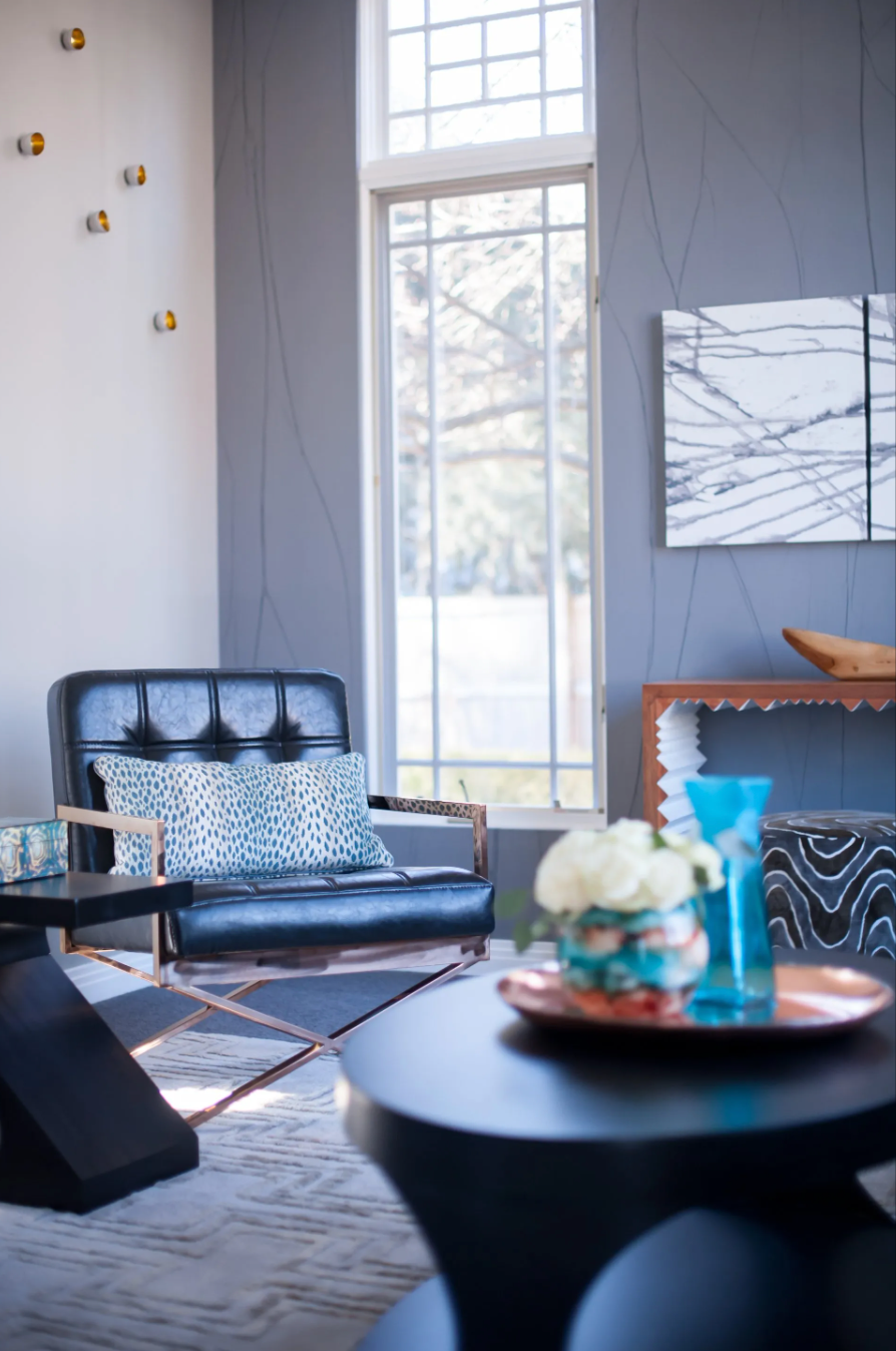 A living room with a couch and two tables