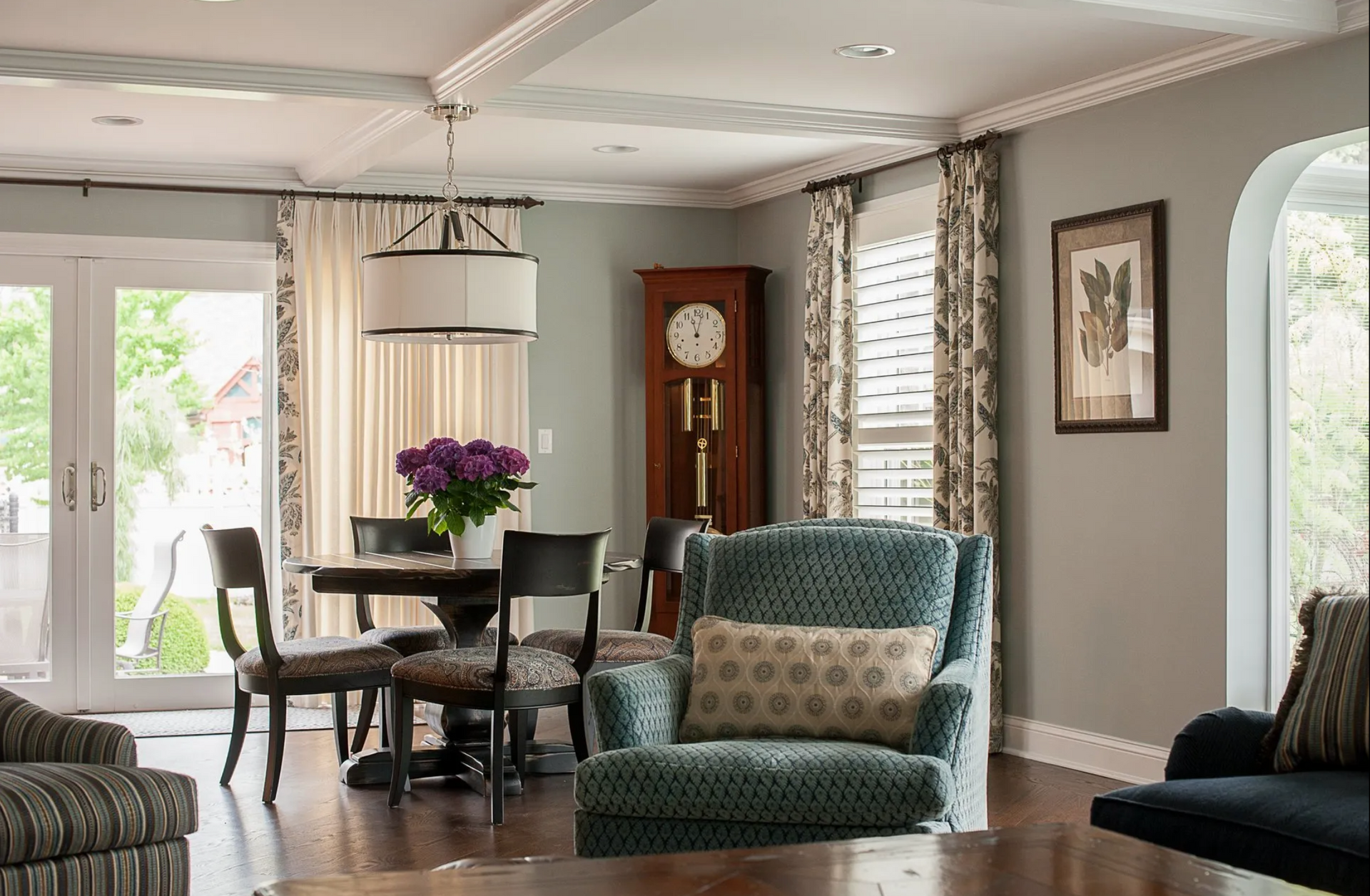 A living room filled with furniture and a clock.
