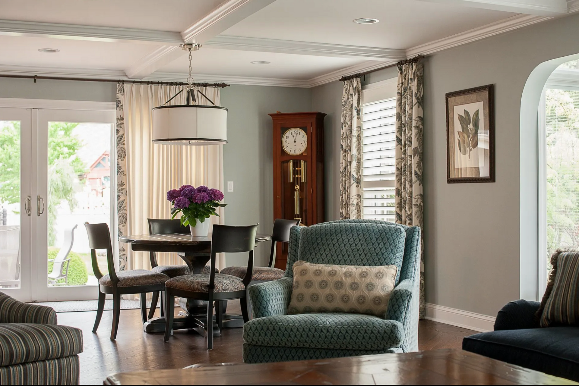 A living room filled with furniture and a large clock.