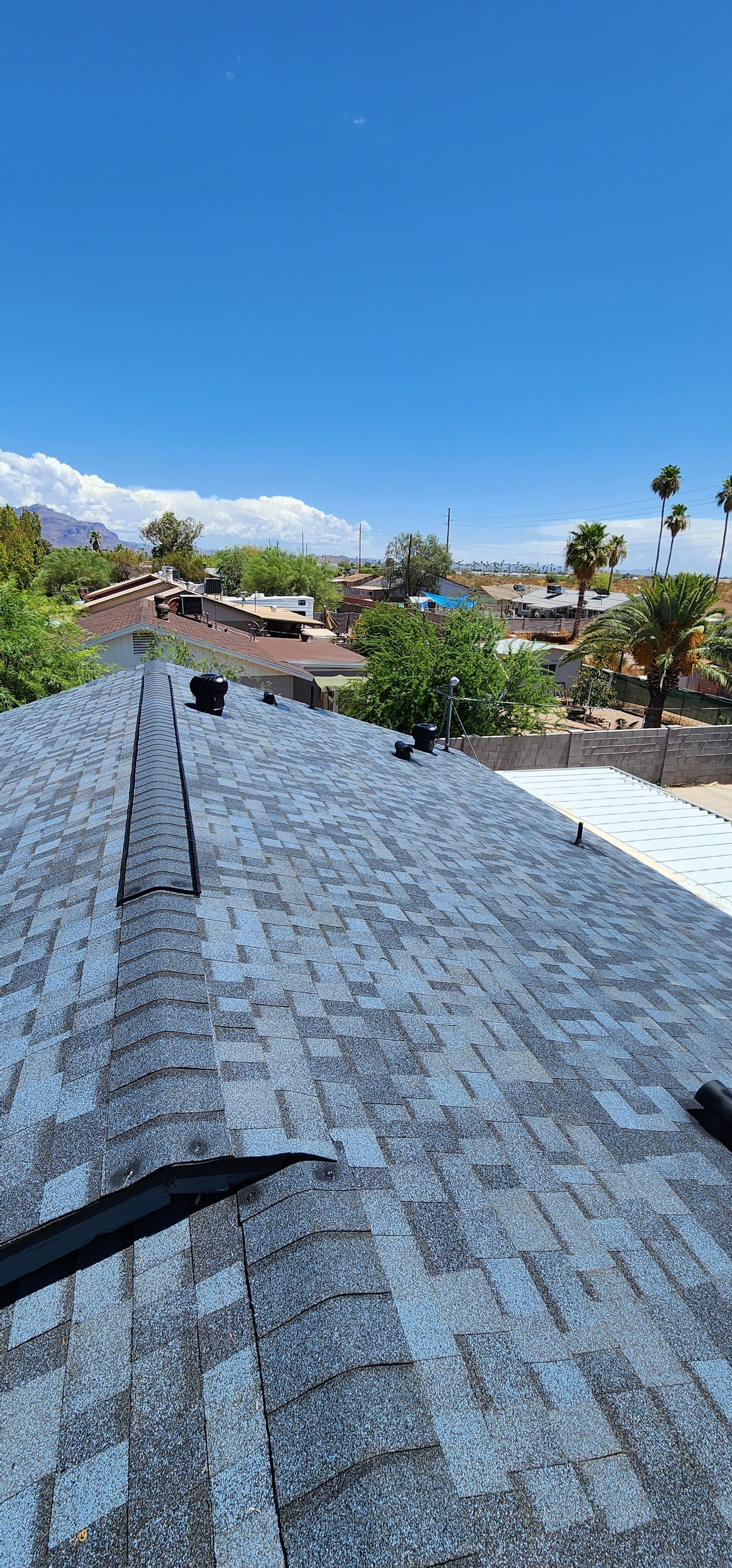 View from a roof of a neighborhood on a bright, sunny day.