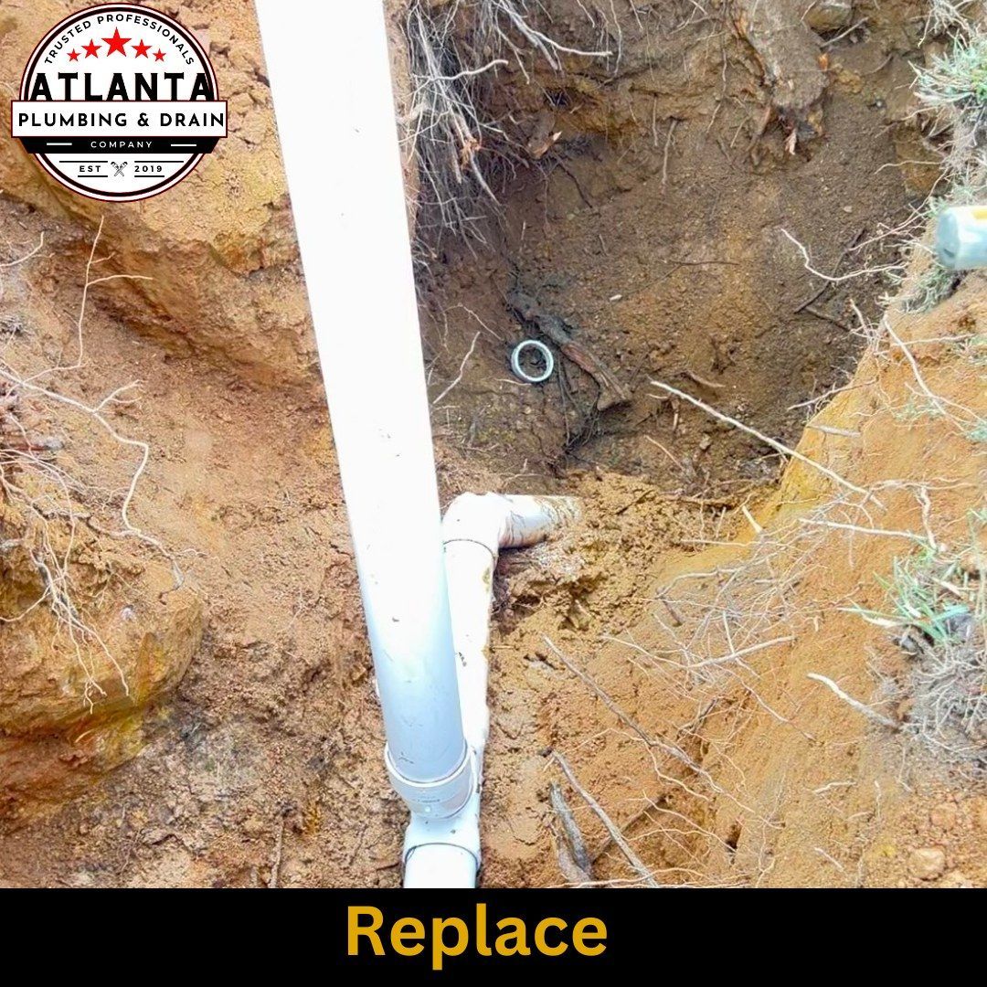 A pipe is being replaced in a hole in the ground.