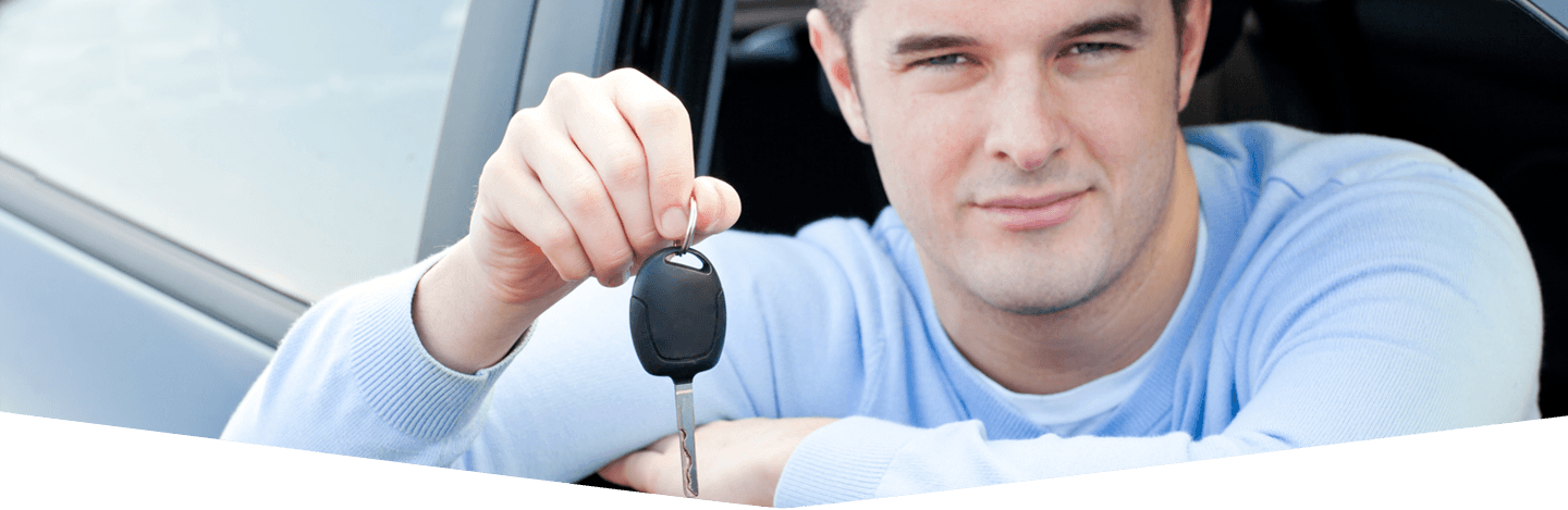 Young individual showing the automobile key