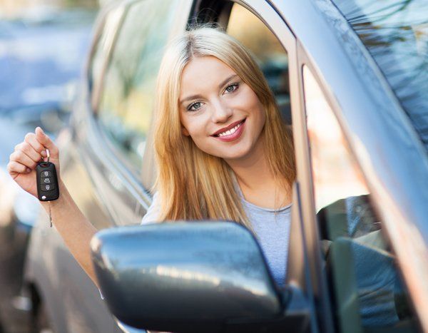 Young confident professional after driving lessons 