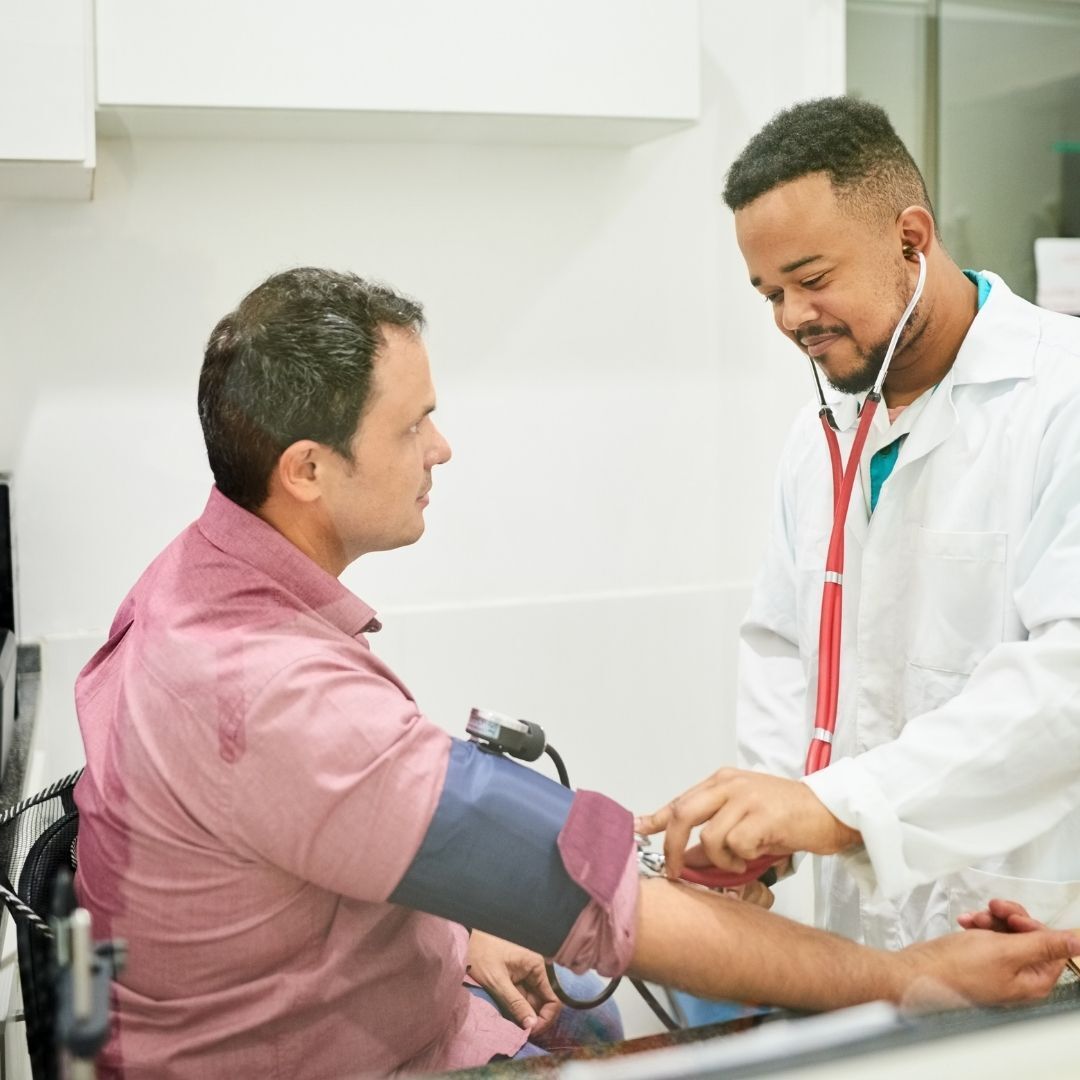 Doctor checking blood pressure