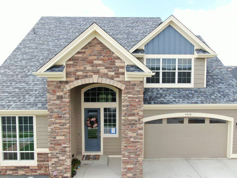 front house with dark gray roof