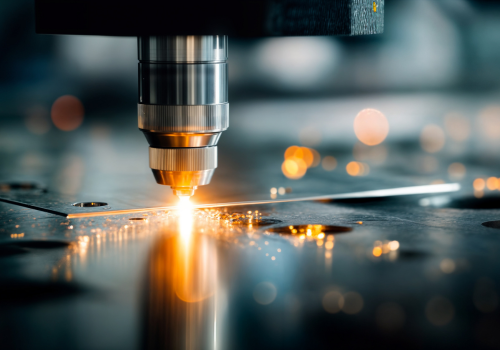 Close-up of a precision tool assembling a semiconductor circuit board.
