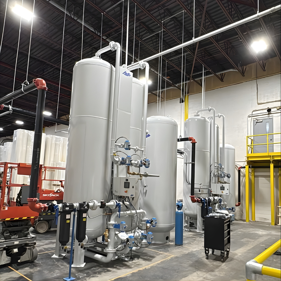 Worker in gloves monitoring a food production line filling metal containers.