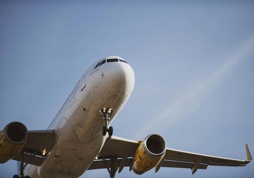 A machine is cutting a metal pipe with sparks coming out of it.