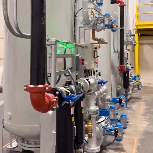 A bunch of pipes are lined up in a room