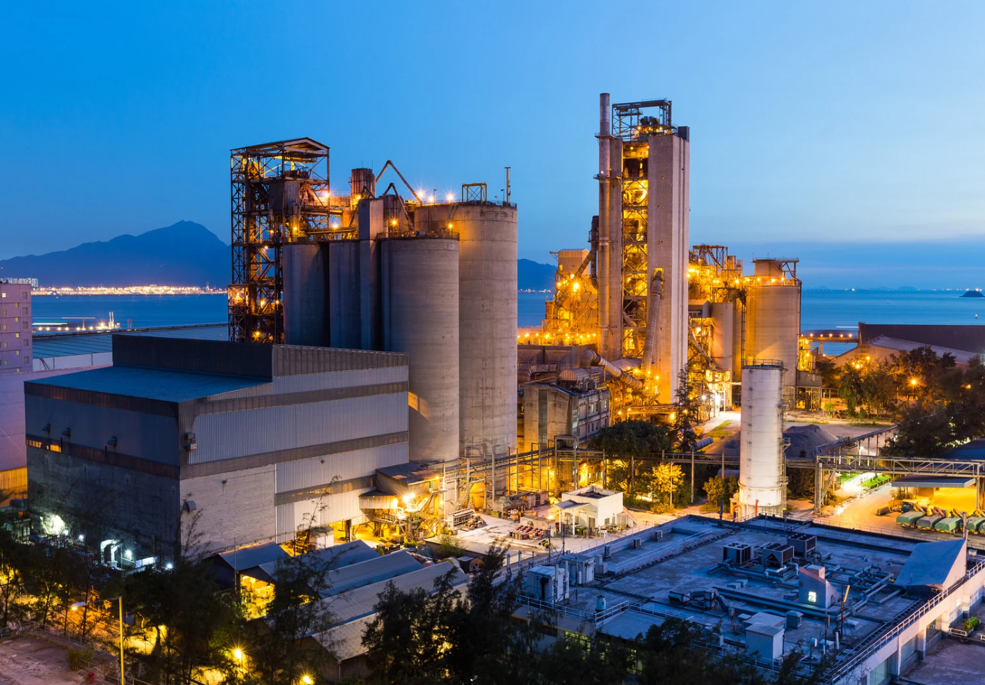 Industrial facility at dusk, showcasing the scale and demand for on-site nitrogen and oxygen generation solutions.
