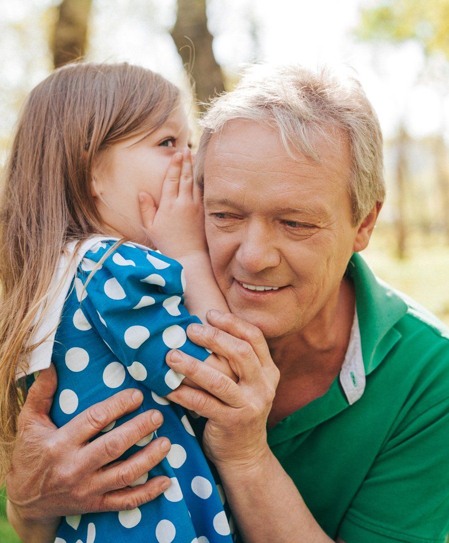 Hearing Aids — Girl Whispering To Her Grandfather in Richlands, VA Hearing Aids — Girl Whispering To Her Grandfather in Richlands, VA
