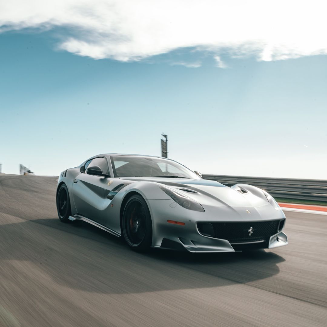 a silver car driving fast