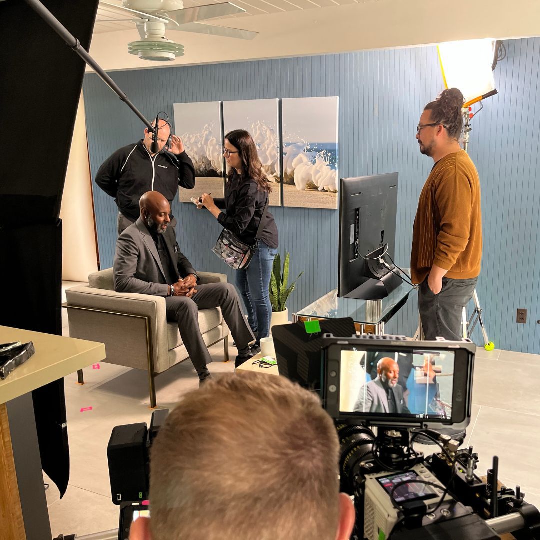 a man talking in front of a camera