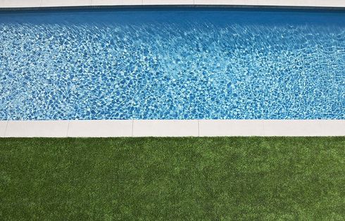 artificial turf installed around the residential pool in Maricopa, AZ.