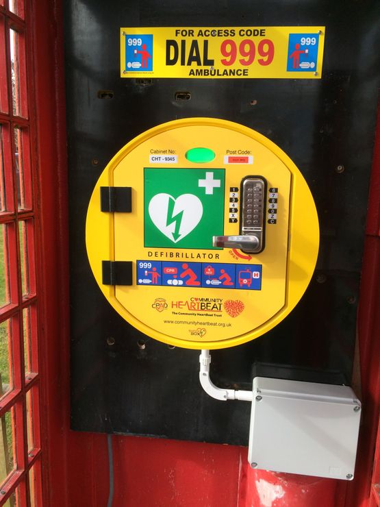 Phone box mounted defibrillator