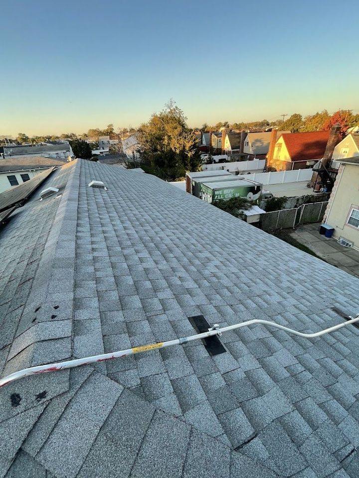 2 men installing concrete roofing