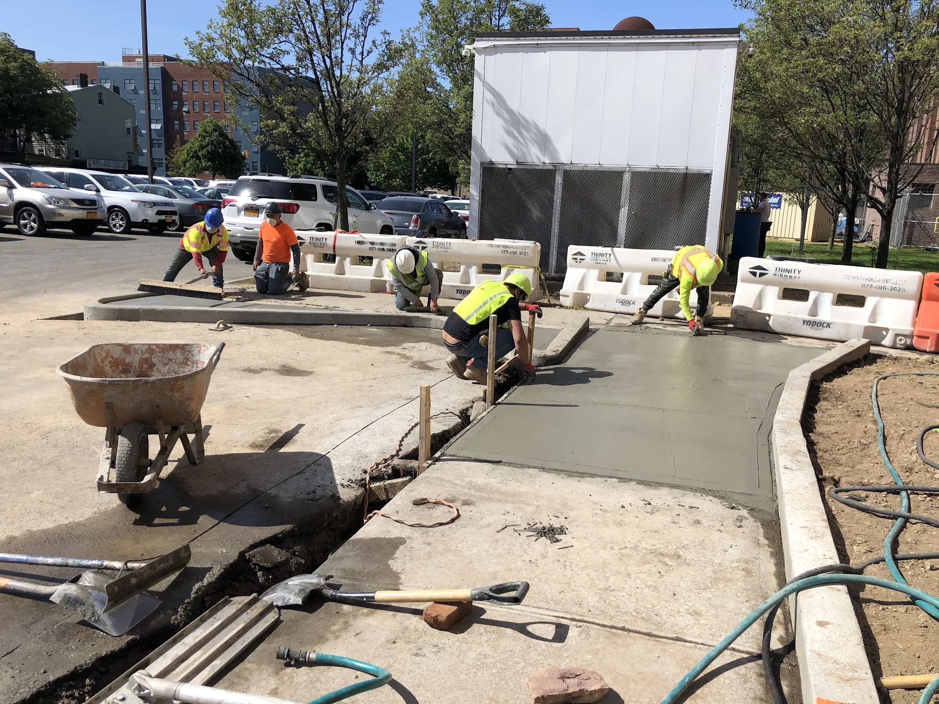 workers attaching aluminum rain gutter