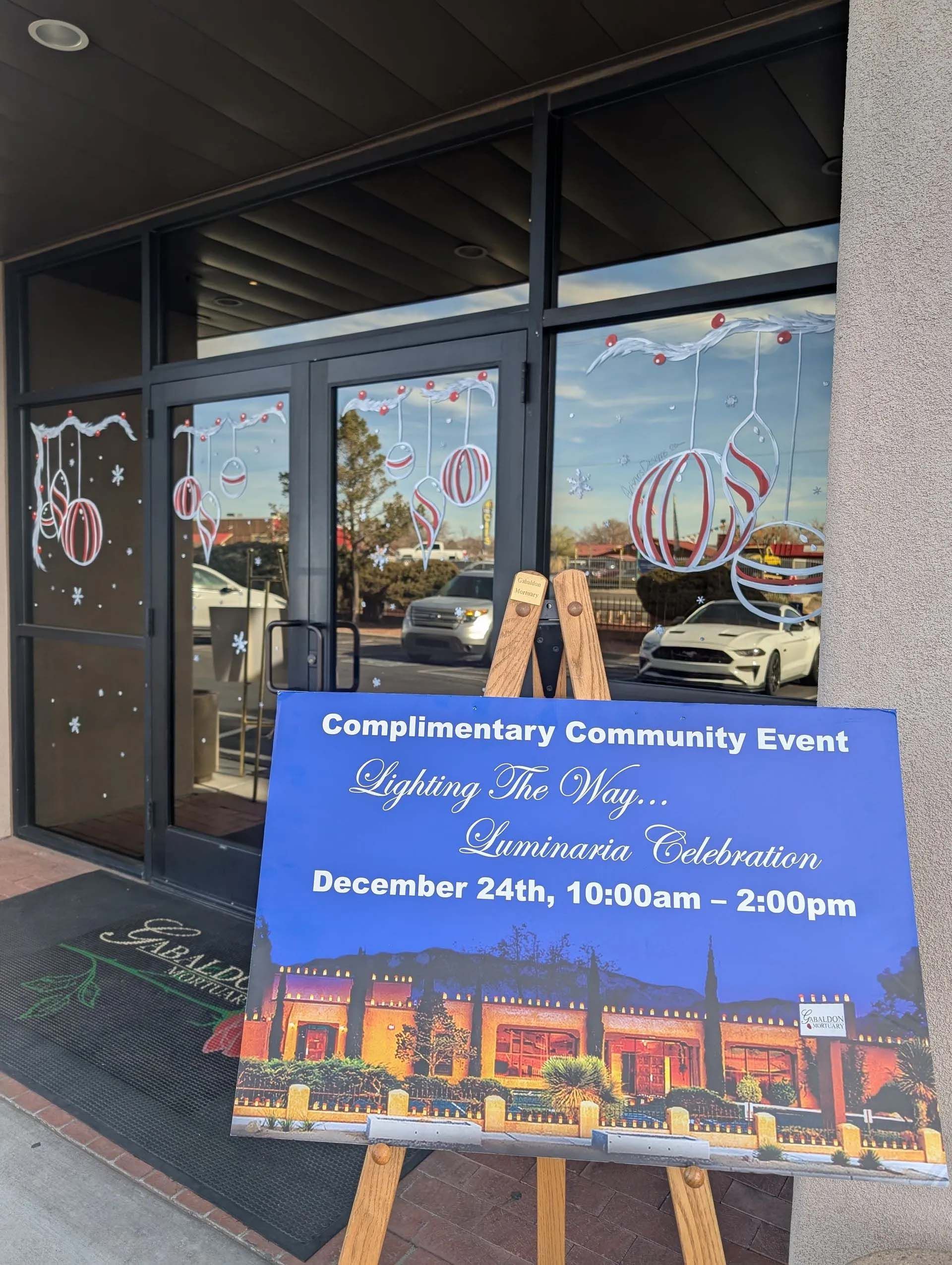 An event sign outside a building. 