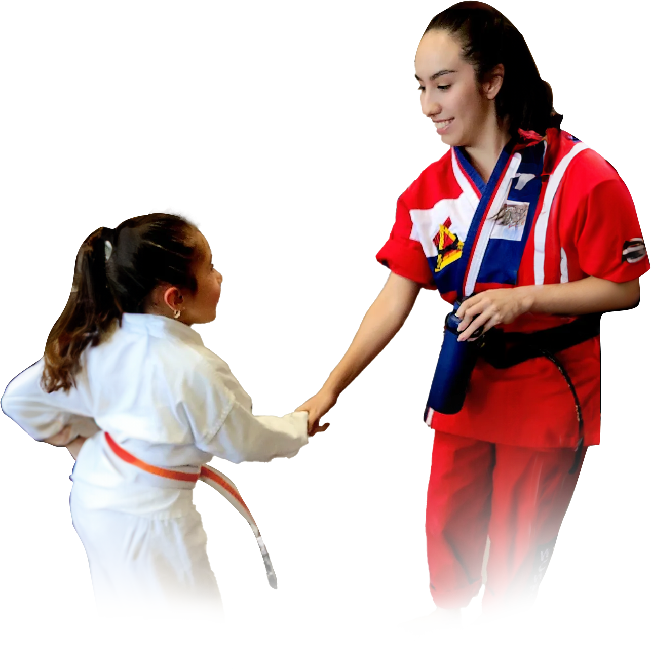 a woman in a red shirt is shaking hands with a little girl