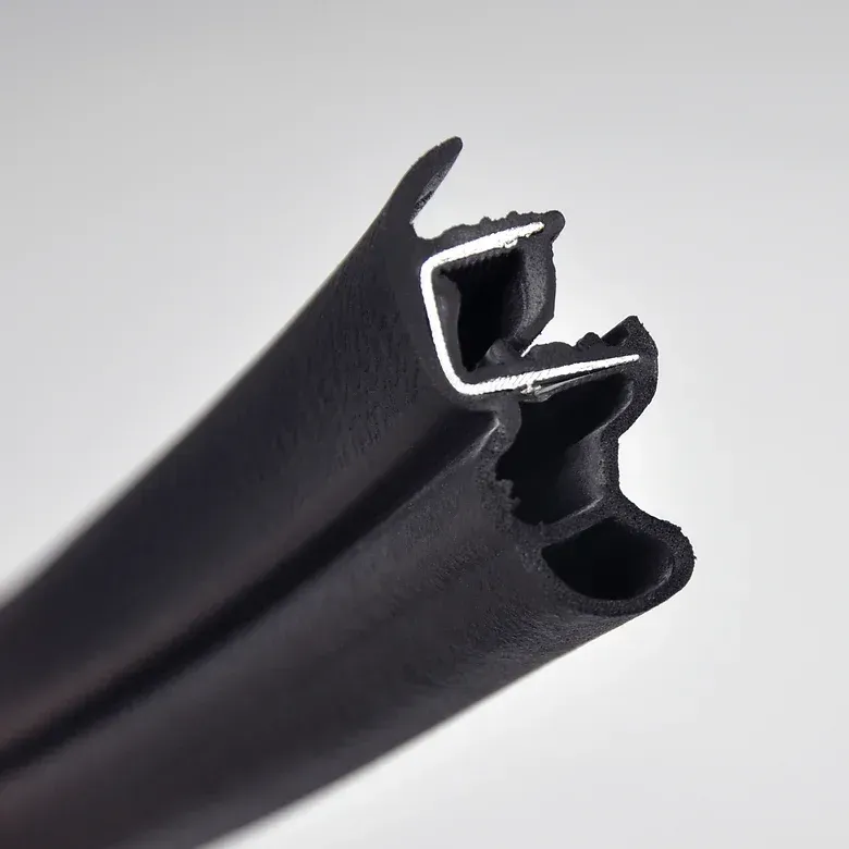 Black rubber and metal extrusion profile, likely a seal, against a white background.
