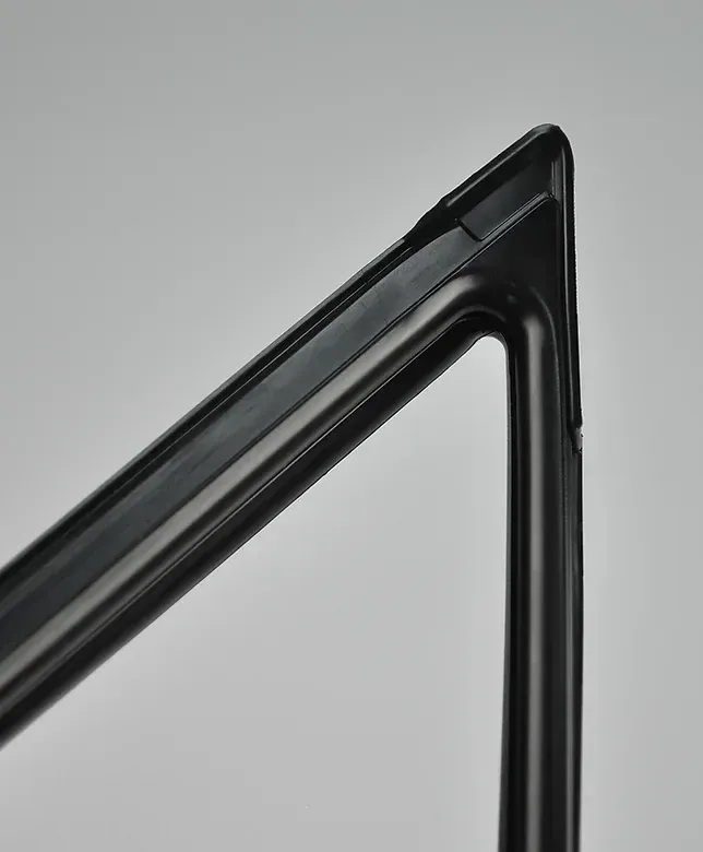 Black, angled frame section against a gray background; corner join visible.