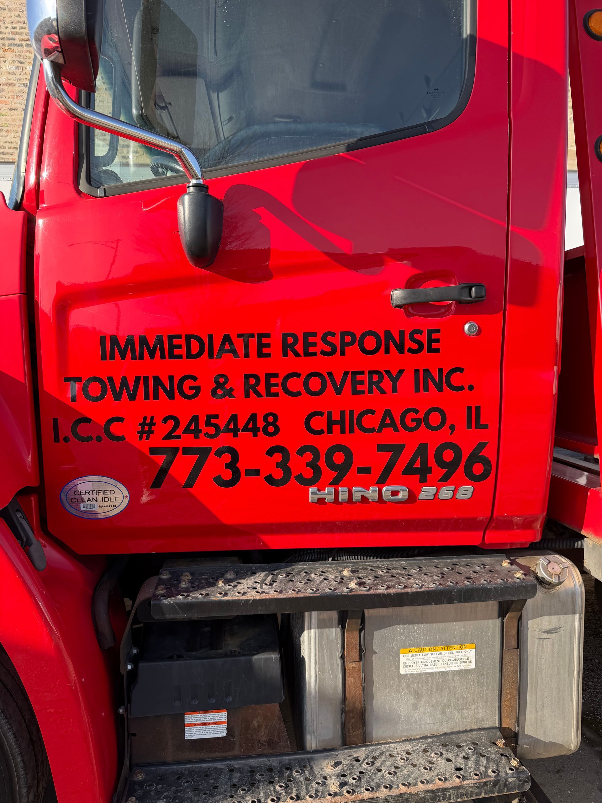 Red tow truck door with