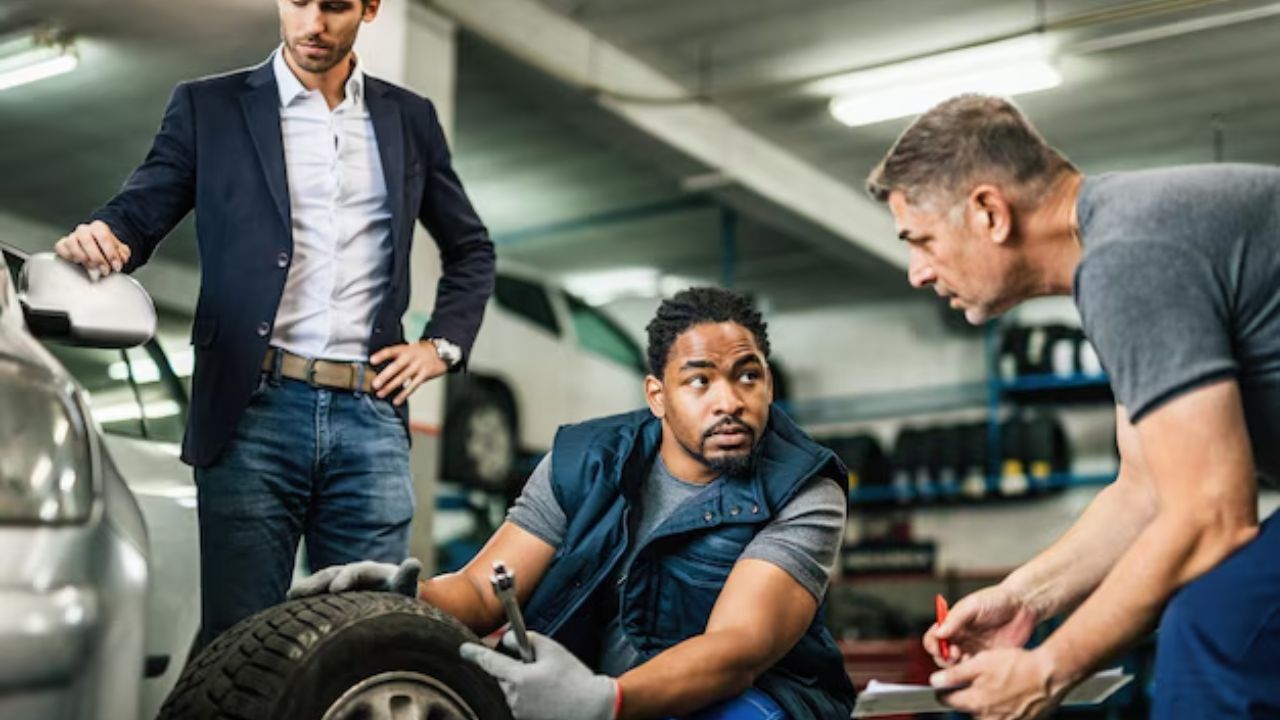 Auto technician discussing tire service