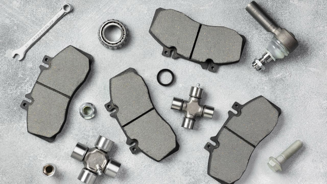 New brake pads and brake system components arranged for a complete brake repair.