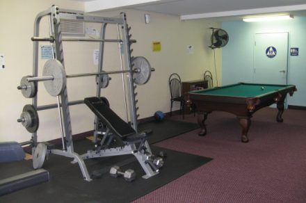The Fitness Center and pool table at Stadium Arms Apartments in San Diego, California