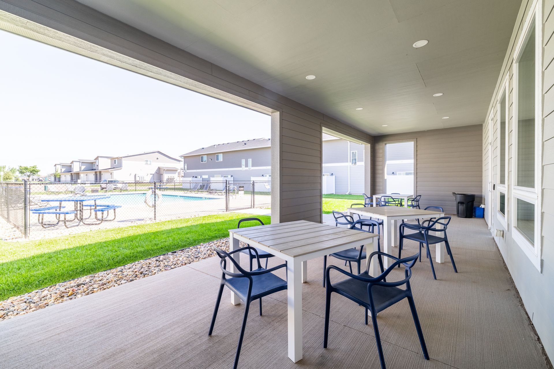 Outdoor patio area with tables and chairs