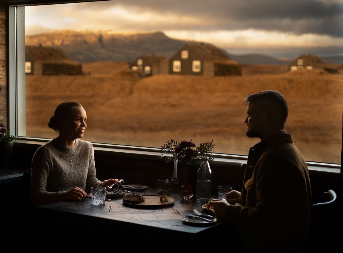 Romantic dinner at torfhus retreat with turf houses in the window