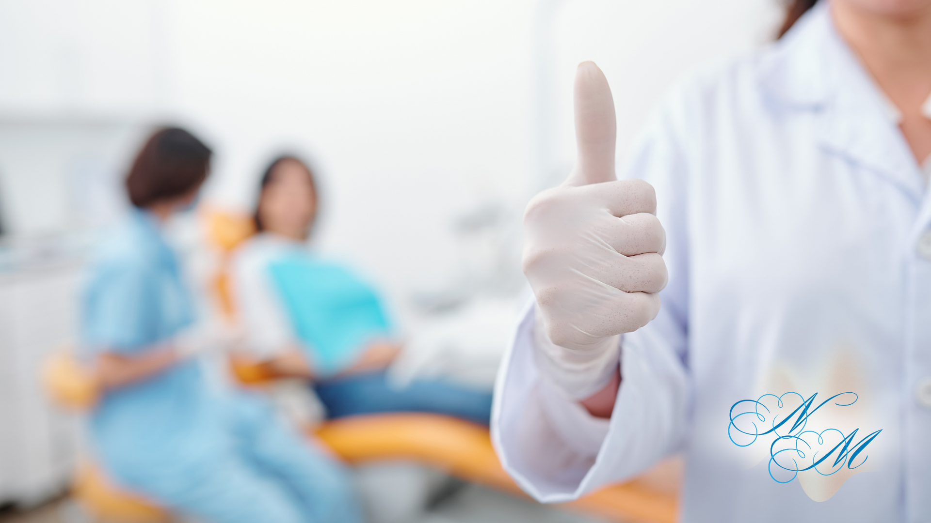 Dentist giving thumbs up in dental office, patient in background.