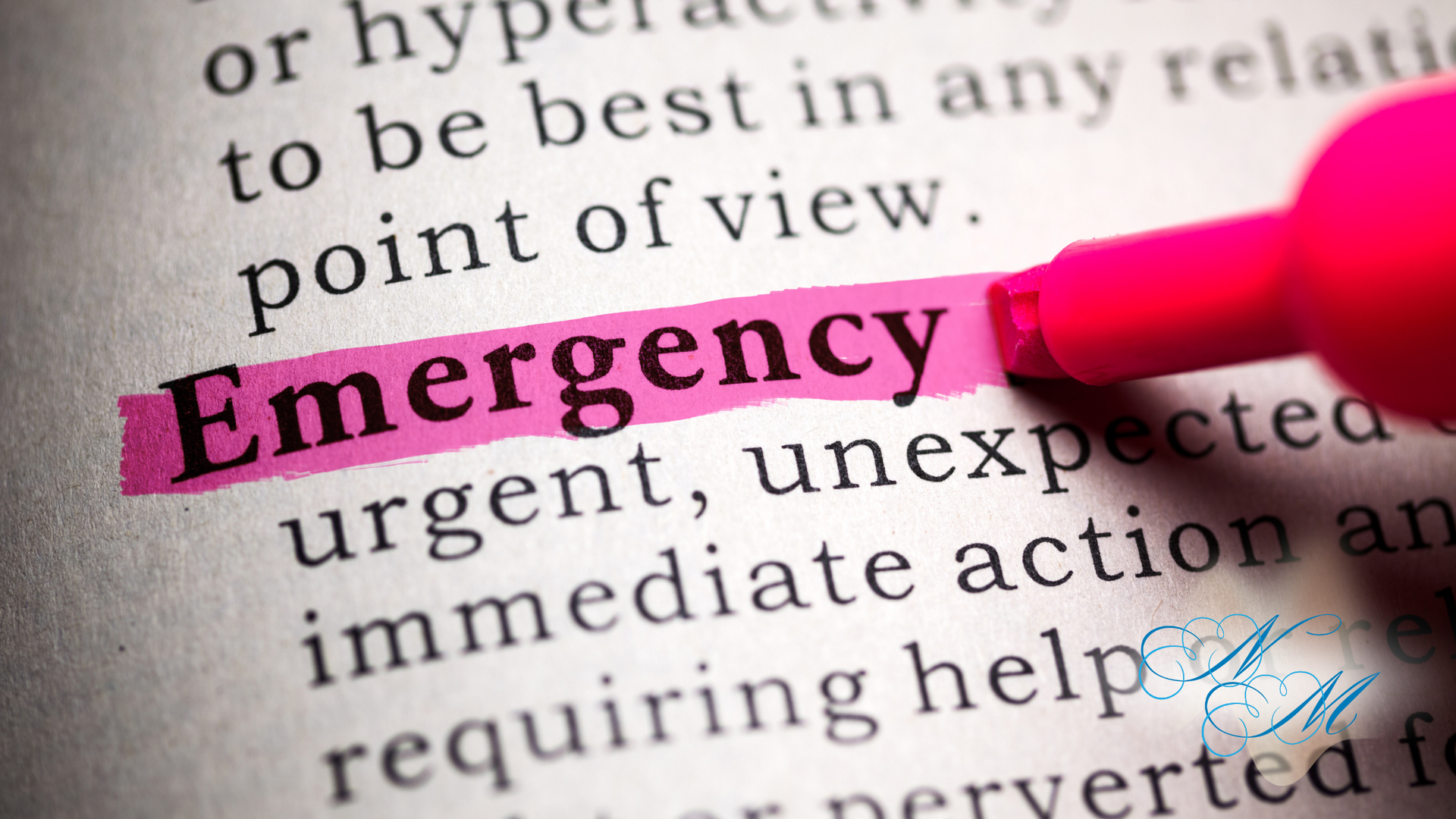 A pink marker is highlighting the word emergency in a dictionary