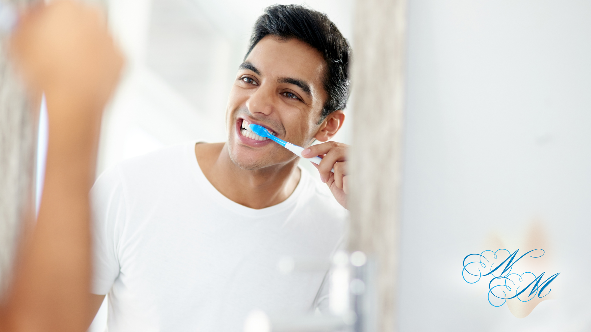Woman brushing teeth with a green toothbrush, mouth open, white foam visible.