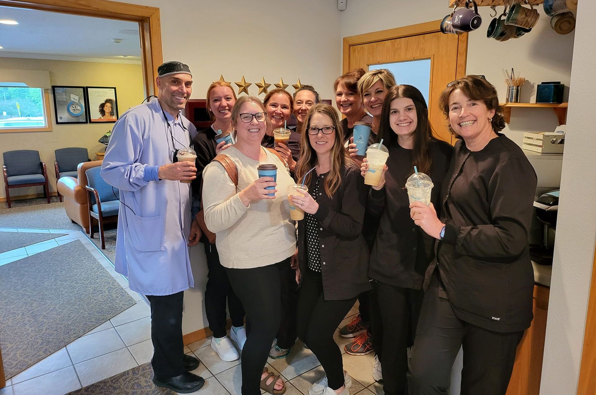 Three women wearing masks and gloves are posing for a picture