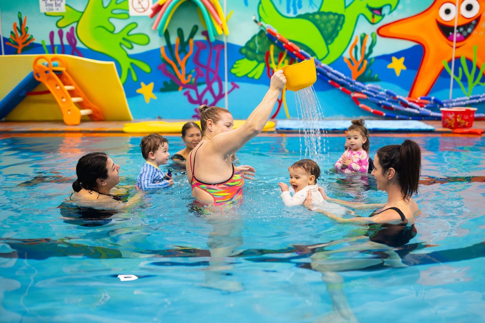 Baby swimming lesson with instructor at Shawn's Swim School
