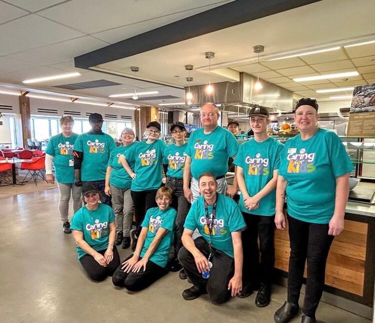 Group of people in teal