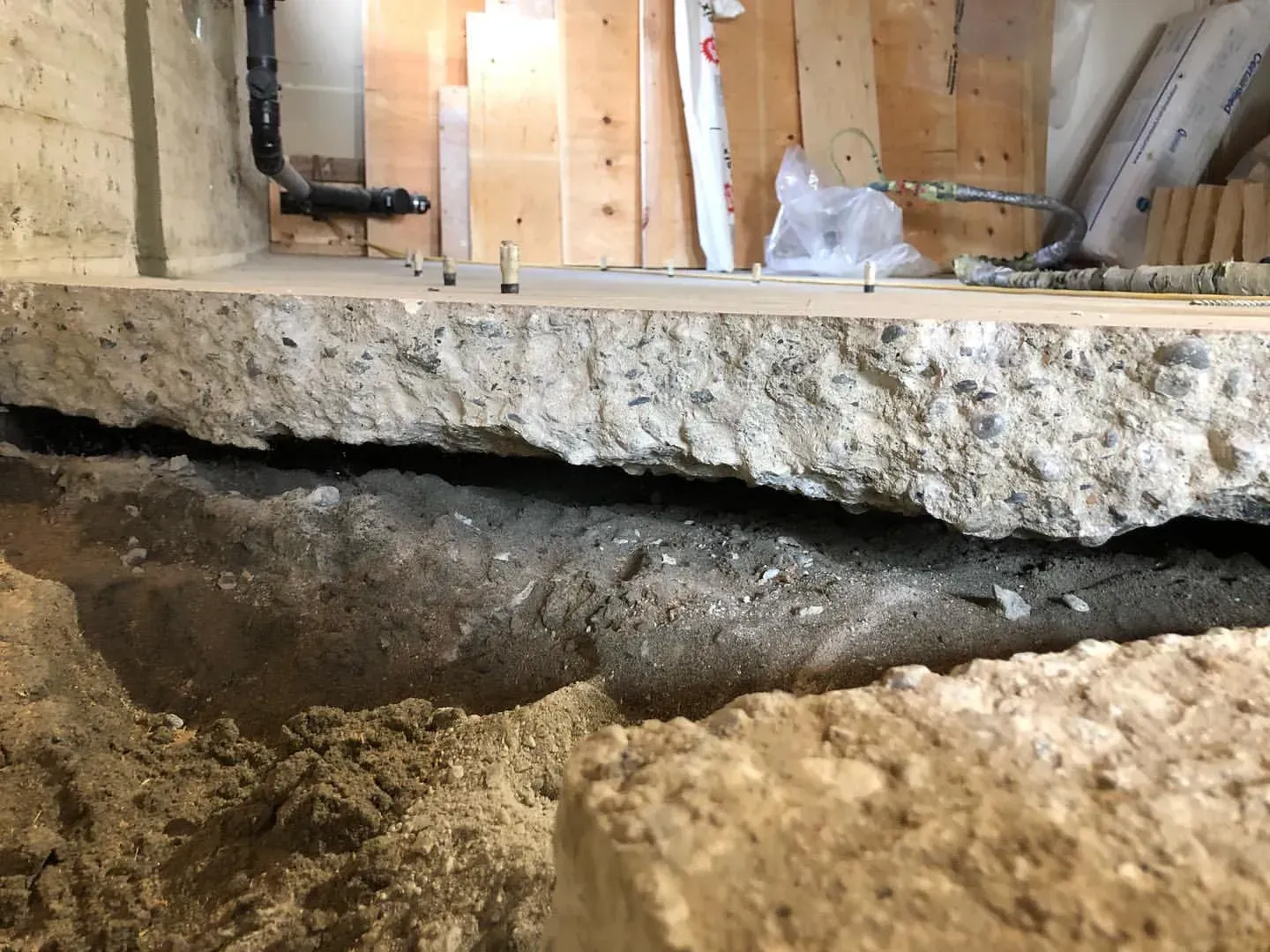 A close up of a concrete floor with a hole in it