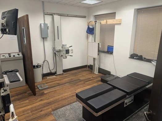 A room with a table and a monitor in it