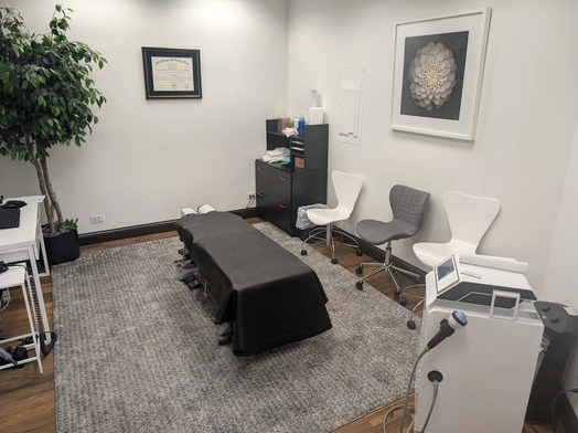 A room with a table and chairs in it