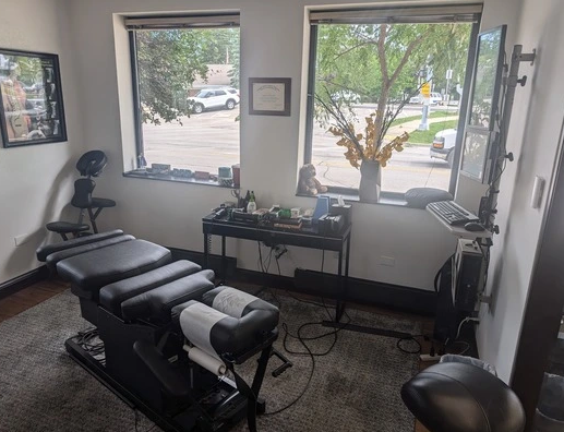 A room with a table and chairs and a window