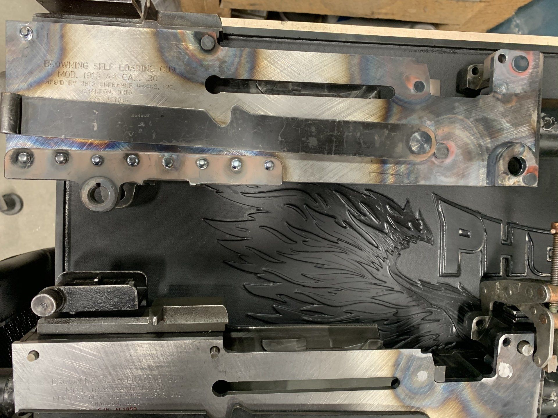 Welded metal framework with engraved eagle design.