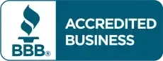 A blue sign that says accredited business on it.