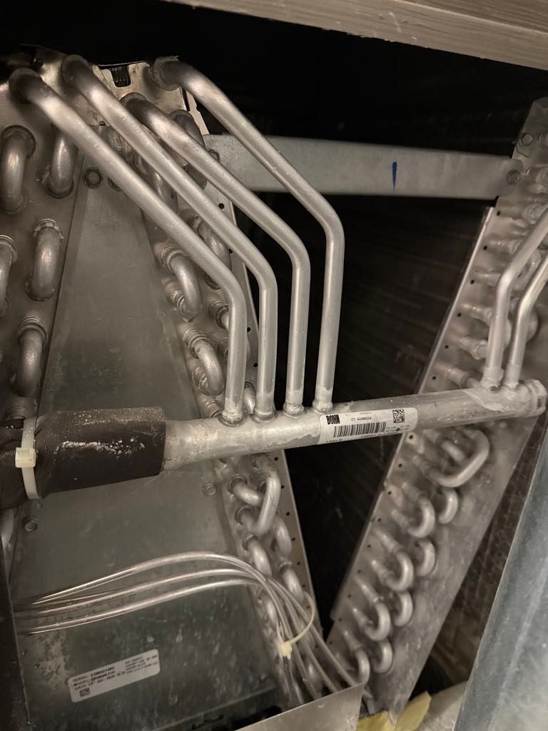 A close up of a metal pipe in a machine.